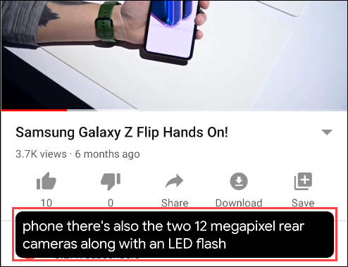 A Live Caption text box under a video on YouTube.