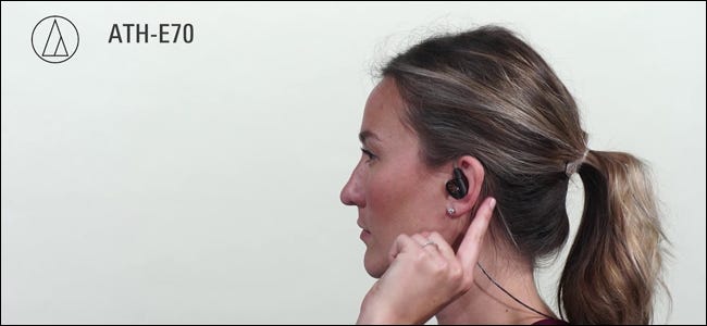 A woman wearing Audio Technica ATH-E70 In-Ear Monitors.