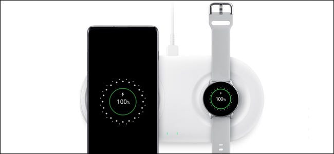 A Samsung phone and watch on a charging Pad.