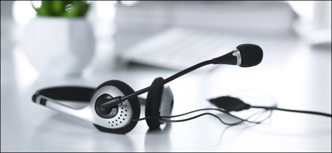 An audio headset with a built-in microphone, which can reduce background noise.