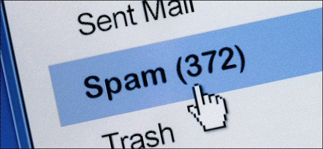 A mouse pointer hand clicking a Spam folder in an email client.