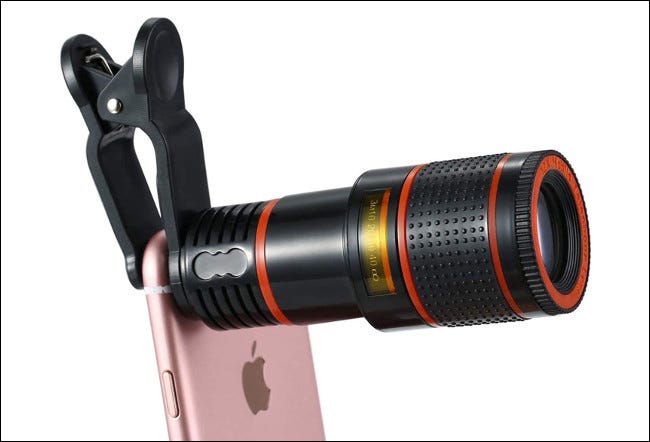A clip-on telephoto lens on an iPhone.