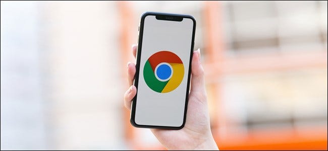 Someone holding an iPhone with the Chrome logo onscreen.