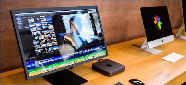 A Mac Mini next to an iMac.