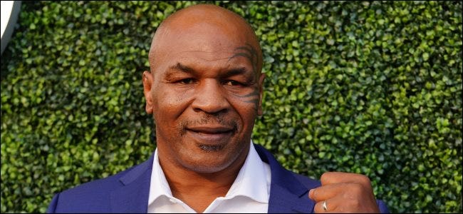 Mike Tyson with a fist raised