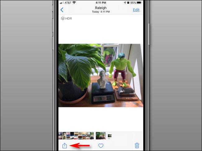 Tap the Share button in the Photos app.